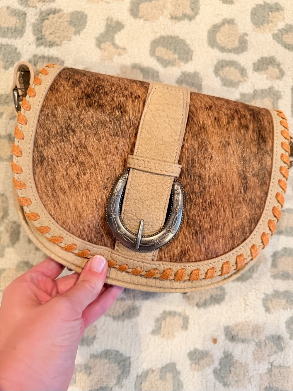Tan Cowhide Crossbody Saddle Bag with Buckle Accent